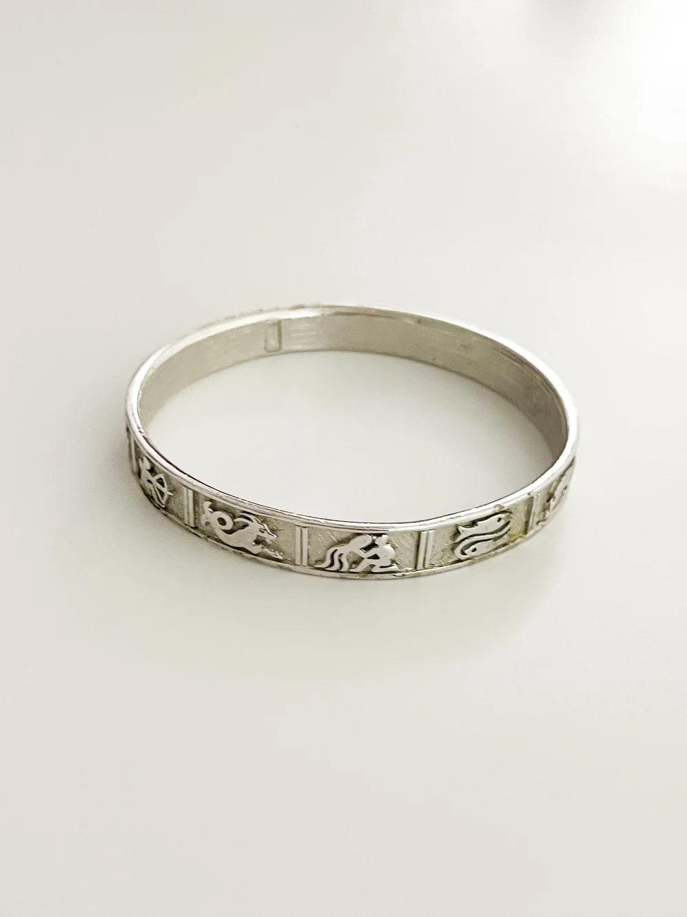 Vintage 1960's Silver Zodiac Symbols Bangle Bracelet — sororité.